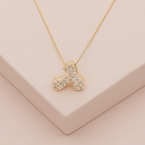 olar letra T com zircônias banhado a ouro 18k hipoalergênico com acabamento delicado.